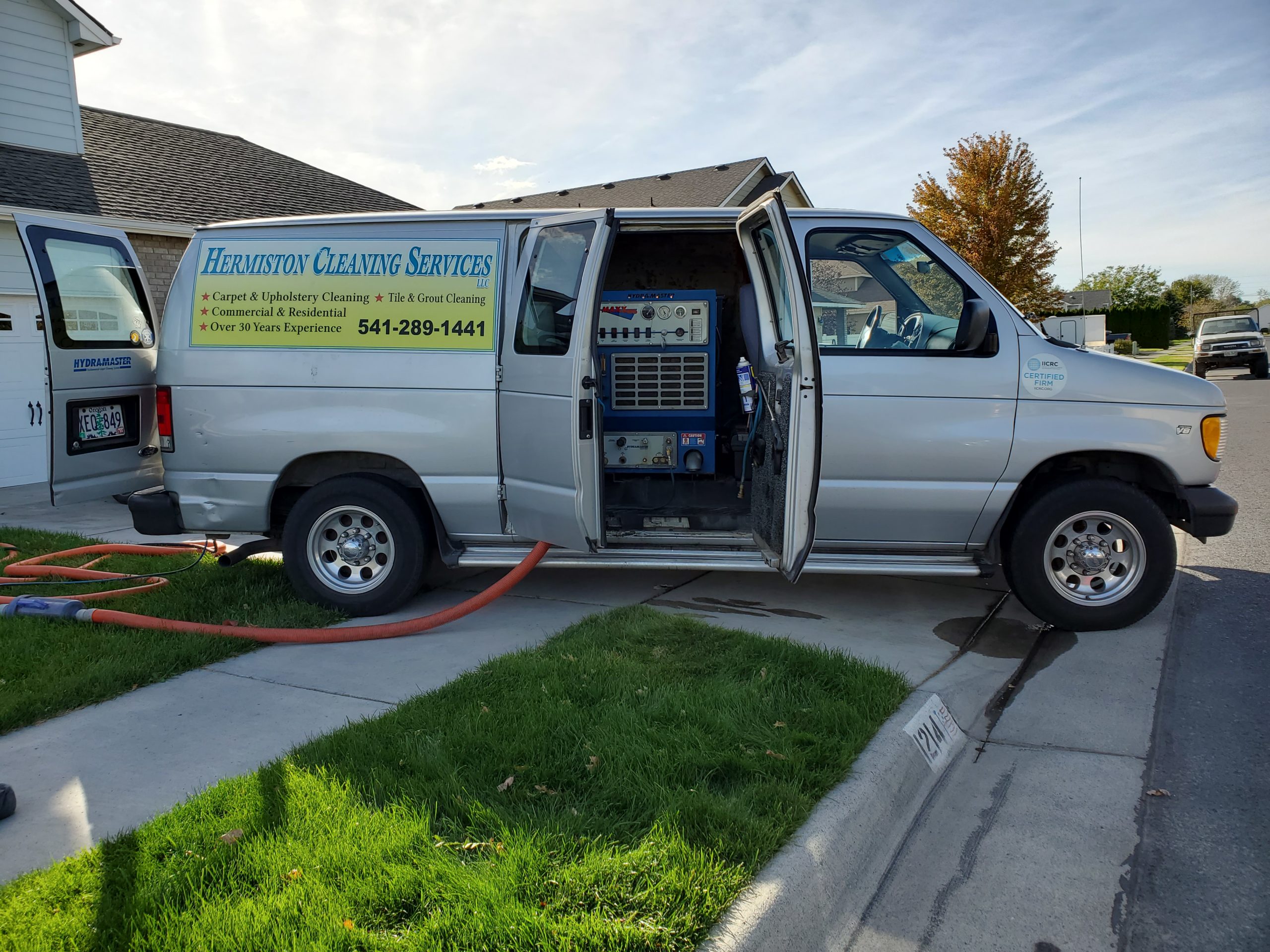 Image of van with truck mounted cleaning system. 