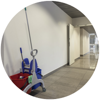 Mop and bucket in an office hallway